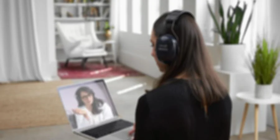 Image of a women consulting with an audiologist via a video appointment
